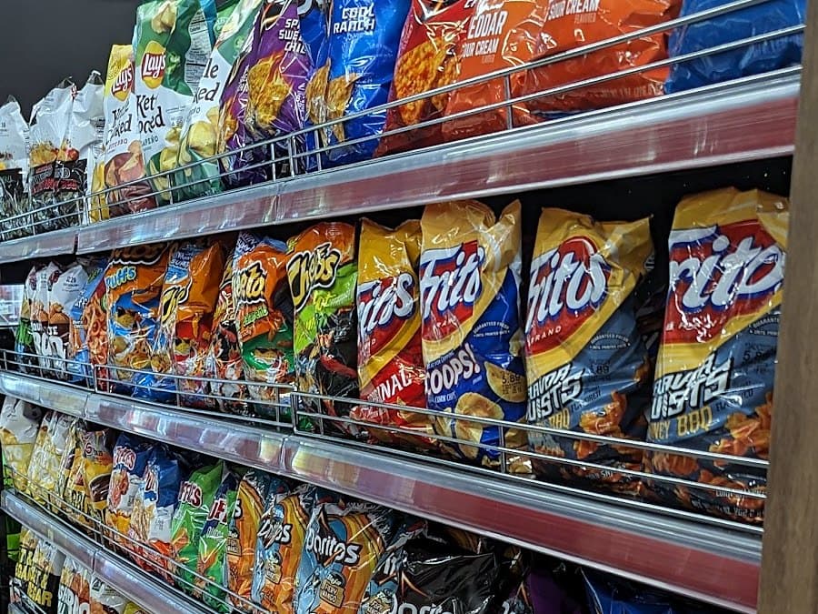 Shelves of Doritos, Fritos, Cheetos and Lay’s